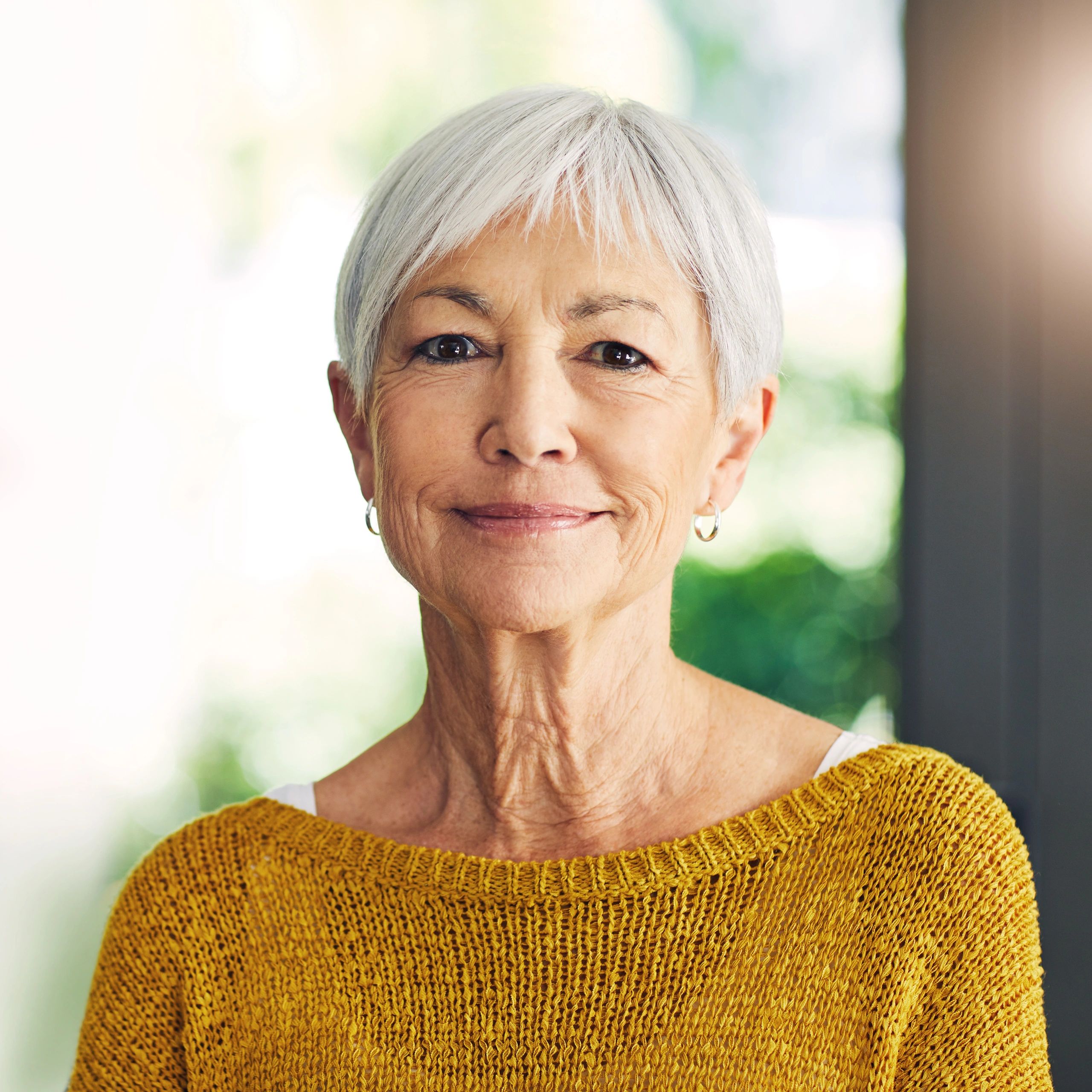 Confident woman over 50 in a warm wellness setting