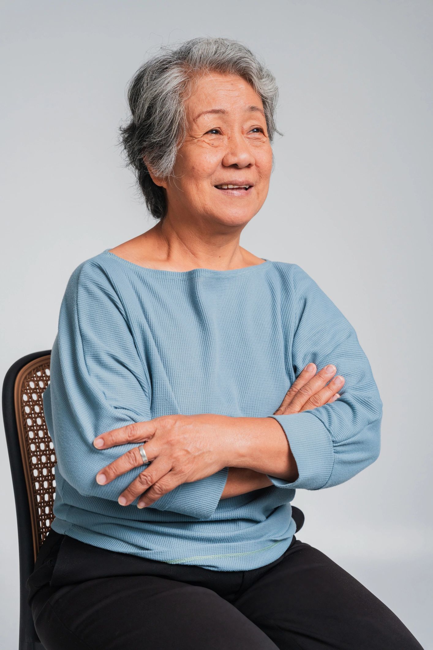 Portrait of a smiling mature woman on a light background